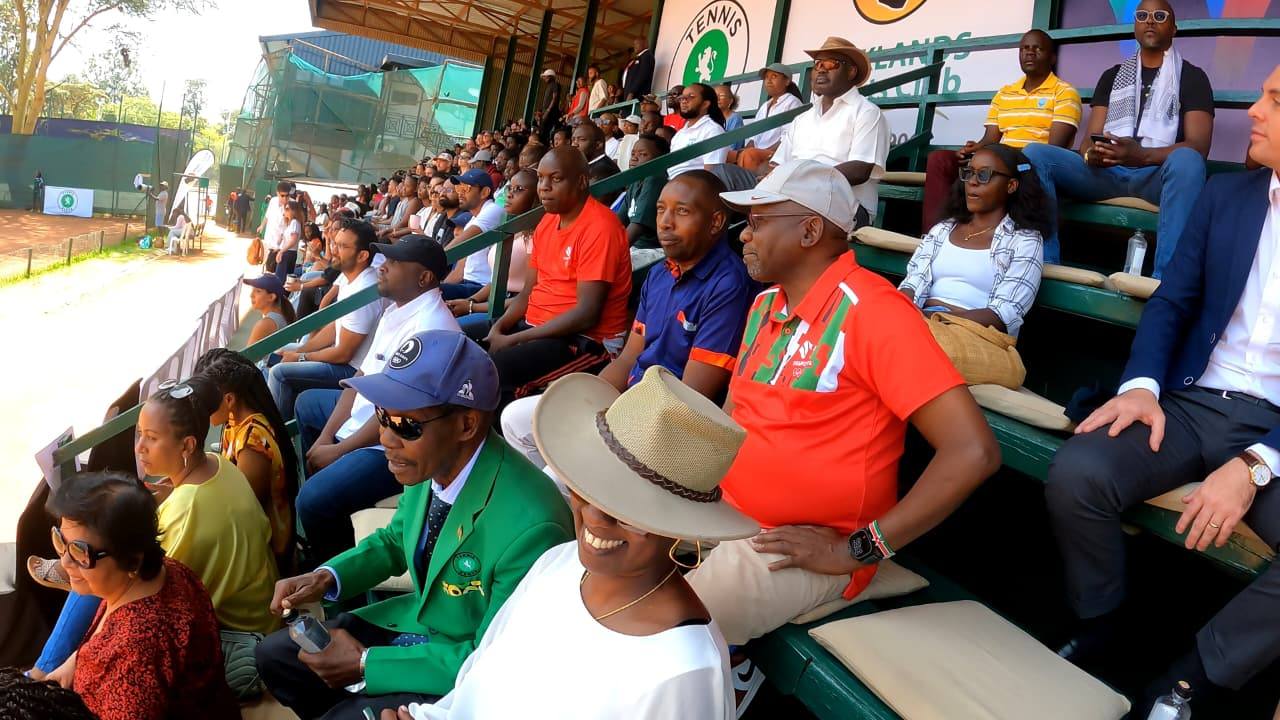 Barnaba Korir, NOC-K First Vice President, Francis Mutuku, former Tennis Kenya Vice President, and Wanjiru Mbugua, Tennis Kenya President, watching the ITF W35 Nairobi final match at Parklands Sports Club.