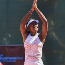 Angela Okutoyi waves to the cheering crowd after winning the ITF W35 Nairobi singles and doubles titles at Parklands Sports Club.